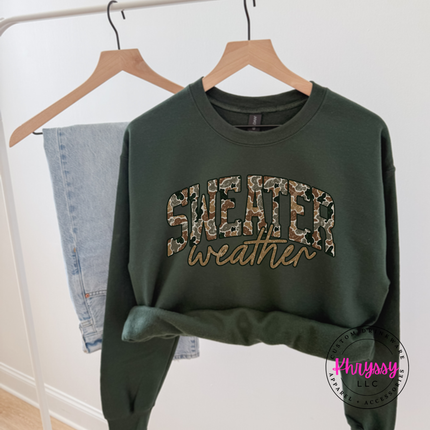 Close up of the Sweater Weather art on a Forest crewneck sweatshirt.