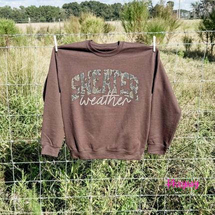 Model wearing the Sweater Weather crewneck sweatshirt in Dark Chocolate.