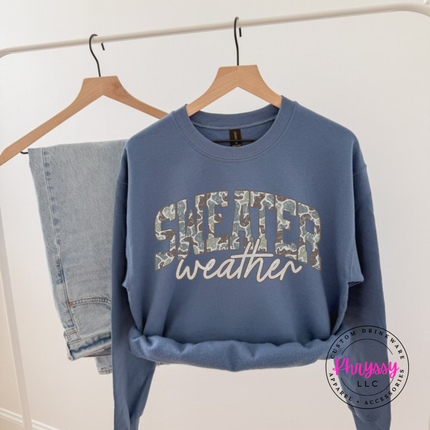 Indigo Blue crewneck sweatshirt showing Sweater in camo leopard with weather script.