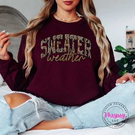 Flat lay of the Sweater Weather Christmas crewneck sweatshirt in Maroon.
