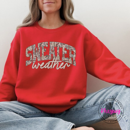 Red crewneck sweatshirt showing Sweater in camo leopard with weather script.