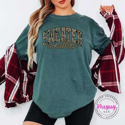 Model wearing the Sweater Weather tee in Blue Spruce.