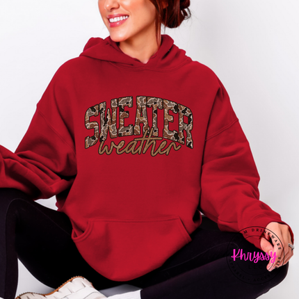 Close up of the Sweater Weather art on a Cardinal Red hoodie.