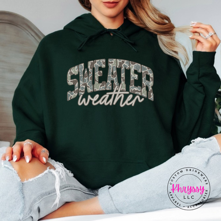 Flat lay of the Sweater Weather Christmas hoodie in Forest.