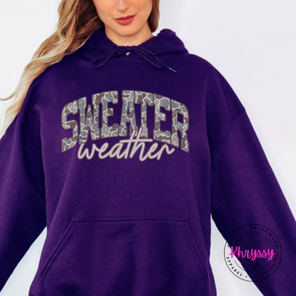 Purple hoodie showing Sweater in camo leopard with weather script.