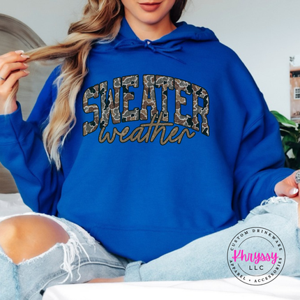 Flat lay of the Sweater Weather Christmas hoodie in Royal.