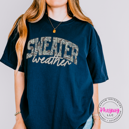 True Navy tee showing Sweater in camo leopard with weather script.