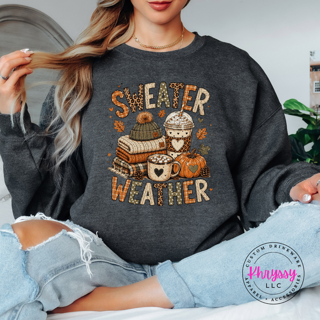 Dark Heather crewneck sweatshirt featuring a sweater weather design with books and coffee