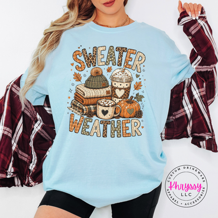 Woman wearing a Chambray tee outdoors with the sweater weather fall graphic