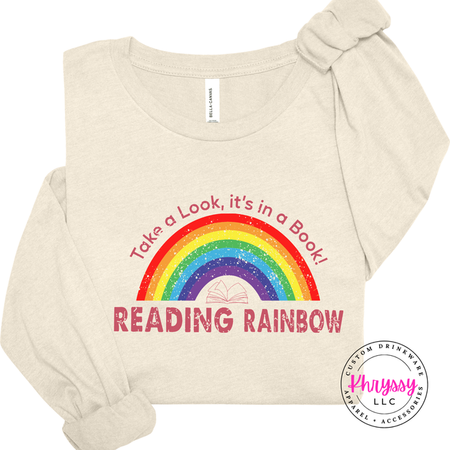 Natural Bella Canvas tee with a retro Reading Rainbow book graphic.