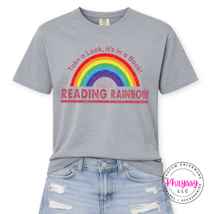 Light gray tee featuring a full rainbow and open book graphic.