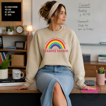 Sand crewneck sweatshirt with take a look it's in a book art.