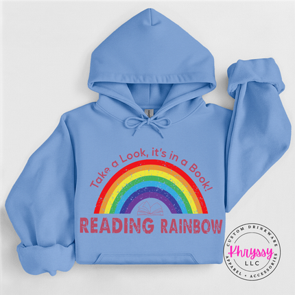 Carolina blue hoodie featuring a full rainbow and open book.