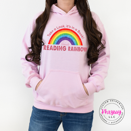 Light pink hoodie with take a look it's in a book art.
