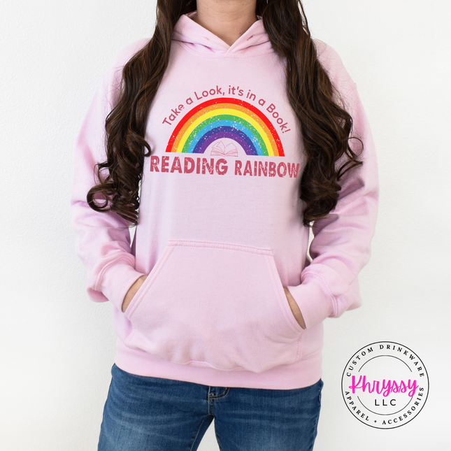Light pink hoodie with take a look it's in a book art.