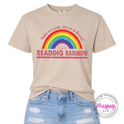 Sandstone tee showing a colorful rainbow and book-lover print.