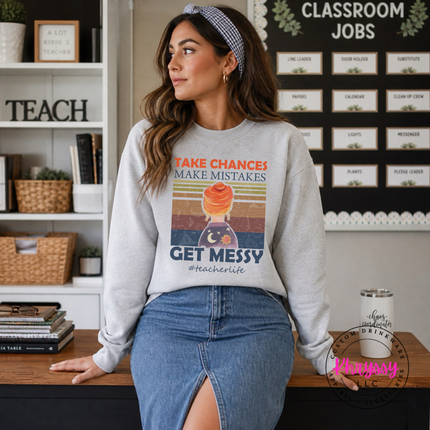 Ash gray teacher crewneck with retro Take Chances Get Messy art.
