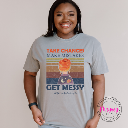 Gray tee with take chances make mistakes get messy lettering.