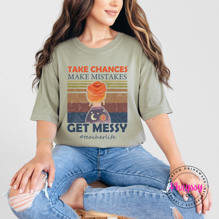 Khaki tee with a bold retro teacher-life sunset graphic.