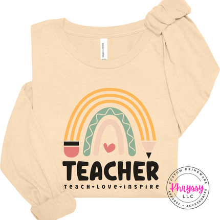 Soft boho rainbow teacher graphic shown on a Soft Cream colored tee.