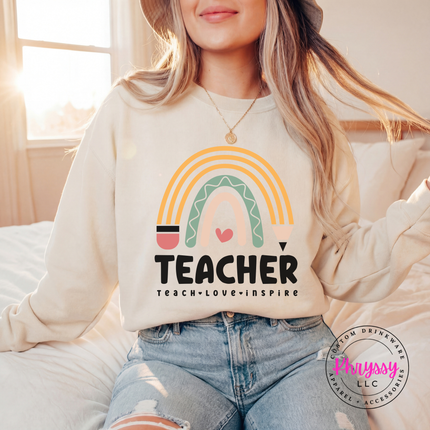 Soft boho rainbow graphic on a cozy Sand pullover sweatshirt.
