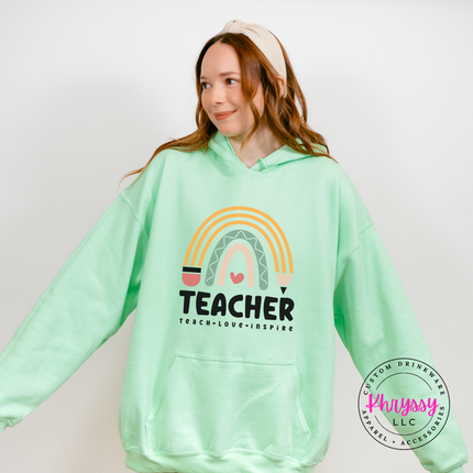 Soft boho rainbow graphic on a cozy Mint Green pullover hoodie.