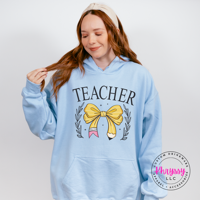 Cozy Light Blue hoodie with elegant teacher bow pencil design.