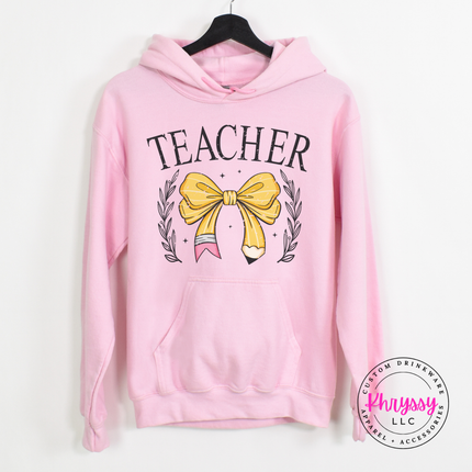 Teacher hoodie in Light Pink, layered for a chilly classroom morning.