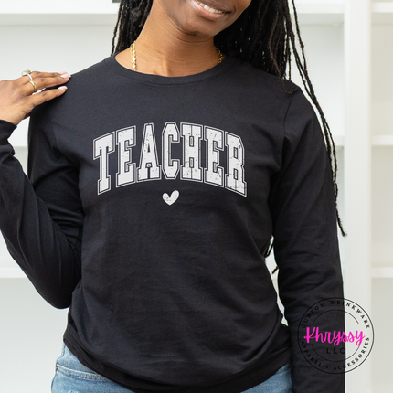 Distressed teacher varsity tee in Black, styled with denim for everyday wear.