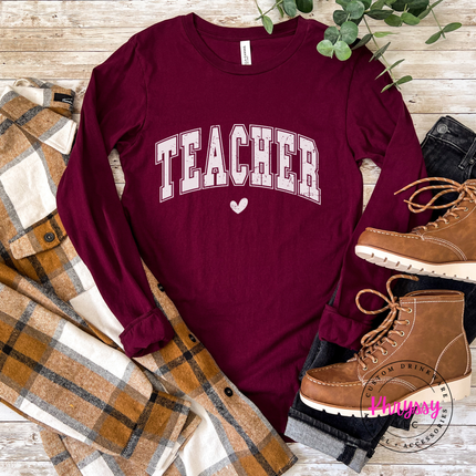 Close-up of the heart accent below arched teacher lettering in Maroon.