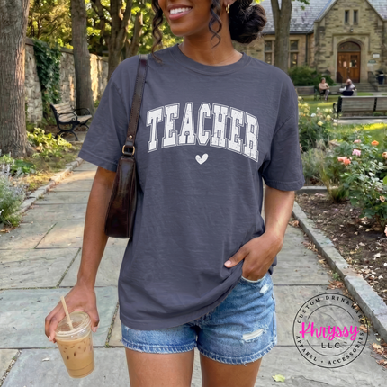 Teacher varsity arch tee shown in Denim, styled with relaxed everyday jeans.