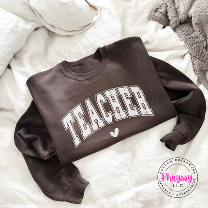 Cozy Dark Chocolate crewneck with vintage teacher varsity graphic.