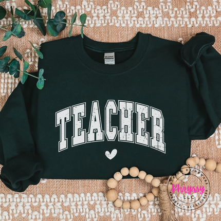 Teacher varsity sweatshirt in Forest, layered over leggings for school days.
