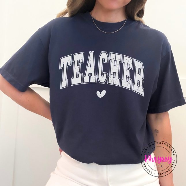 Distressed teacher varsity graphic on a soft Navy pigment-dyed t-shirt.