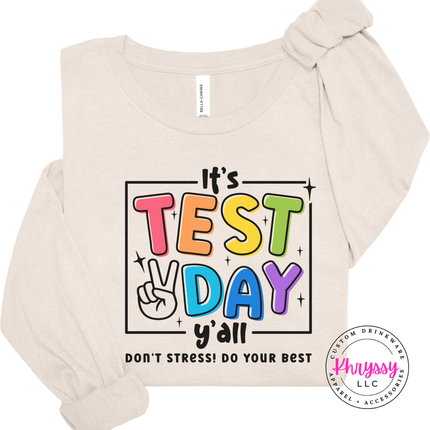 Lightweight test day teacher tee in Natural with colorful peace sign graphic.