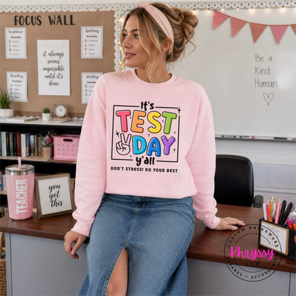 Test day crewneck in Light Pink, layered for a chilly exam morning.