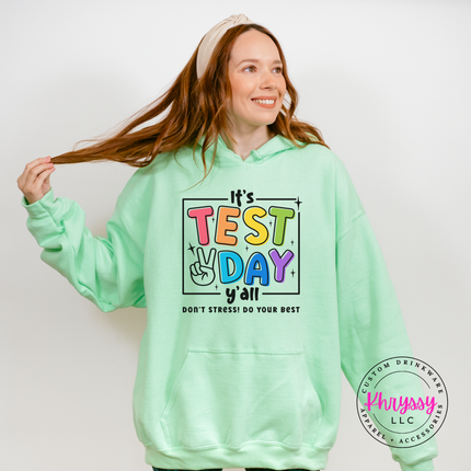 Close-up of bold multicolor test day lettering on a Mint Green hoodie
