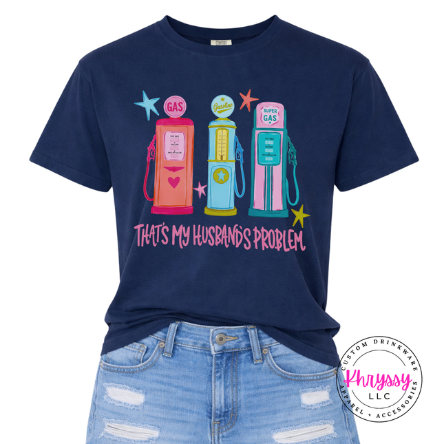 Navy blue t-shirt with colorful gas pump graphic and text 'That's My Husband's Problem' on a white background.