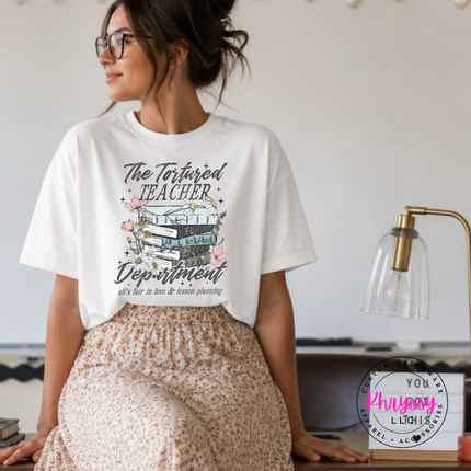 White cotton tee with a floral tortured-teacher book design.