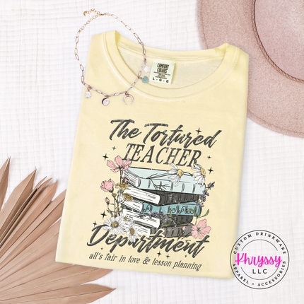 Butter yellow tee featuring a watercolor book stack and florals.