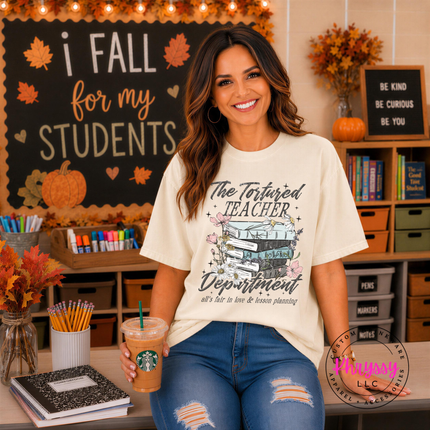 Ivory tee with The Tortured Teacher Department script and floral books.