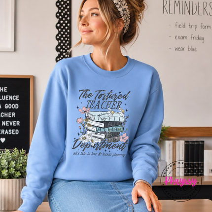Carolina blue crewneck featuring a watercolor book stack and books.