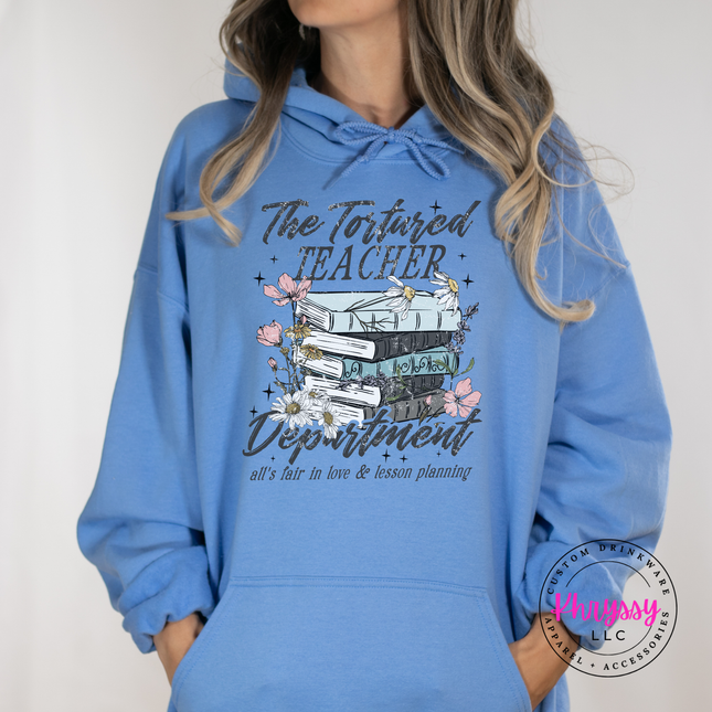 Carolina blue hoodie featuring a watercolor book stack design.
