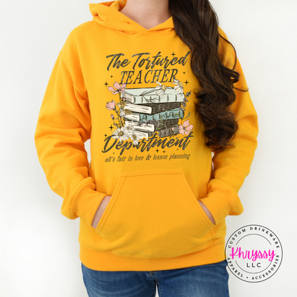 Gold hoodie with moody literary teacher lettering and books.