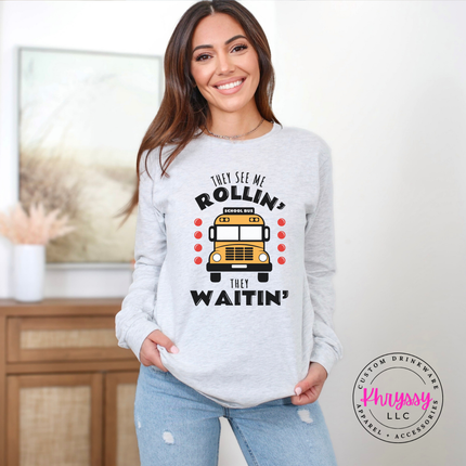 Woman wearing an Ash tee with a funny school bus driver graphic.