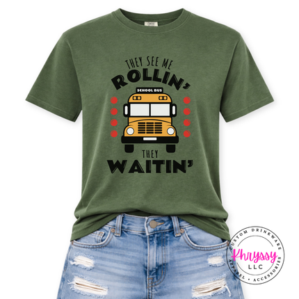 Close-up of a Hemp tee featuring a bold yellow school bus design.