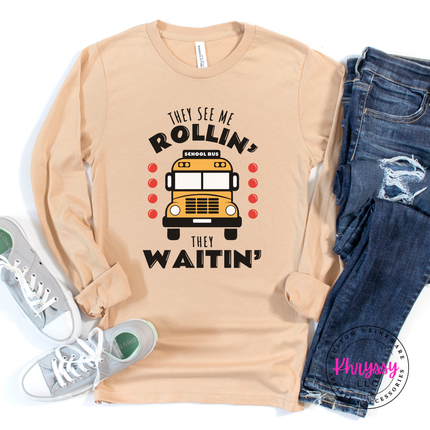 Sand Dune tee flat lay with the bold yellow school bus graphic.