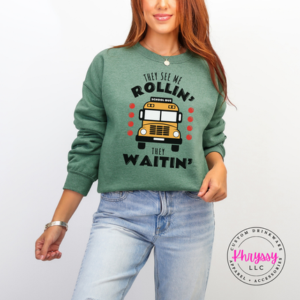 Heather sport dark green crewneck sweatshirt flat lay with the bold yellow bus graphic.