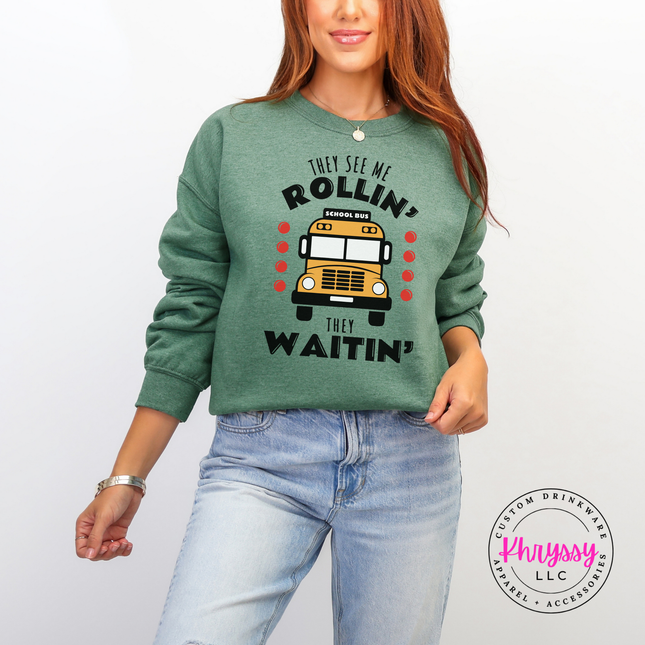 Heather sport dark green crewneck sweatshirt flat lay with the bold yellow bus graphic.