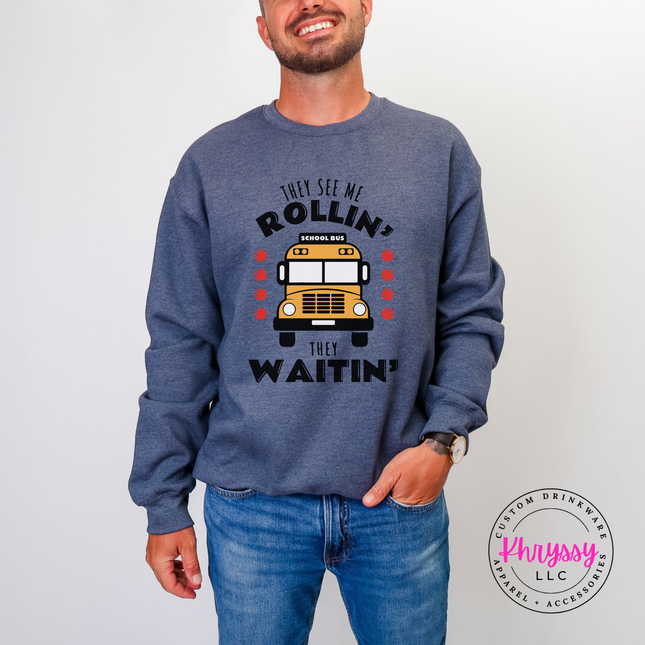 Heather sport dark navy crewneck sweatshirt worn outdoors, highlighting the colorful bus design.
